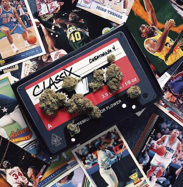 A cannabis brand called Classix laid out on the table with various baseball cards