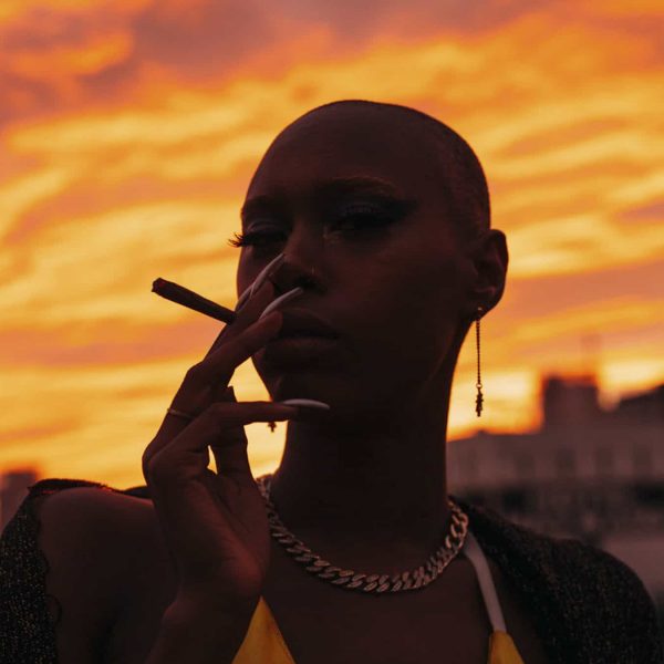 headshot of black women smoking cannabis